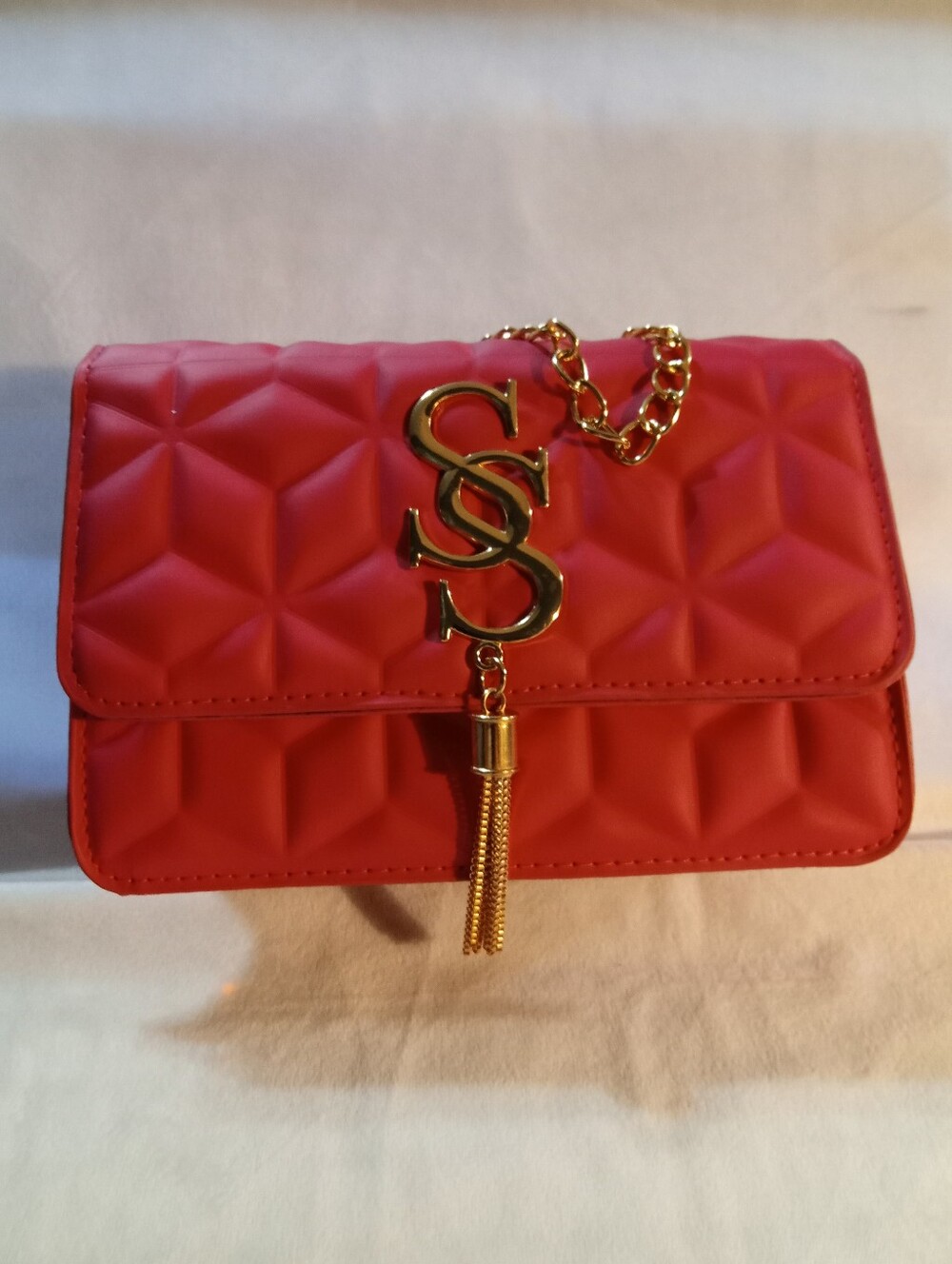 Red Quilted Chain Shoulder Bag with Gold Tassel Accent